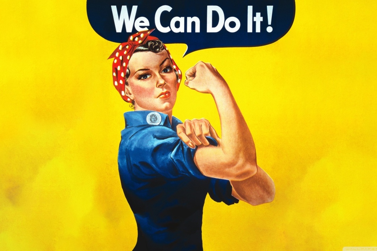 Rosie the Riveter flexiona el brazo con gesto decidido frente al cartel “We Can Do It!”, símbolo del trabajo femenino durante la Segunda Guerra Mundial.