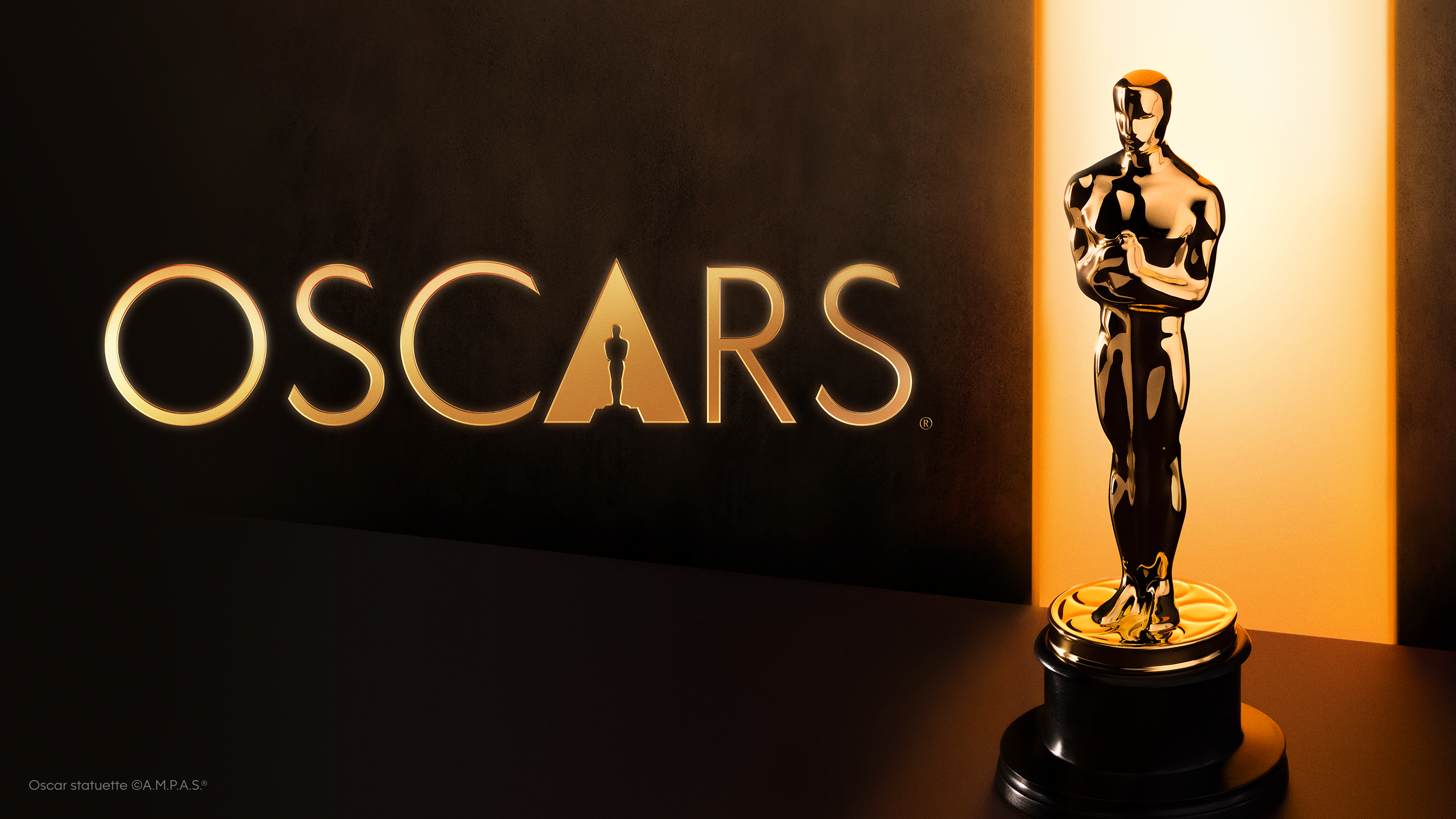 Estatuilla del Oscar junto al logo oficial de los Premios de la Academia